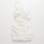 White floral earrings on a white background