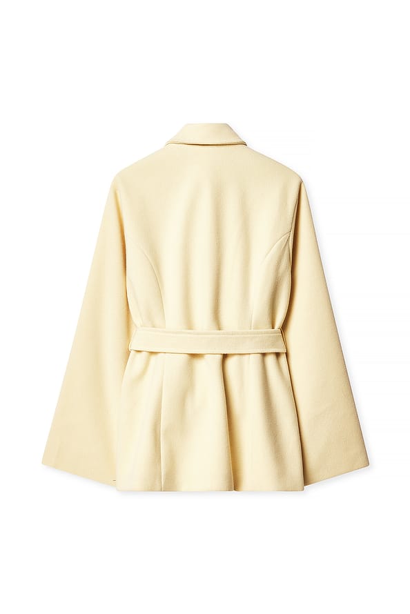 Beige coat on a white background