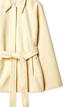 Beige coat with a belt on a white background