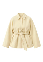 Beige coat with a belt on a white background